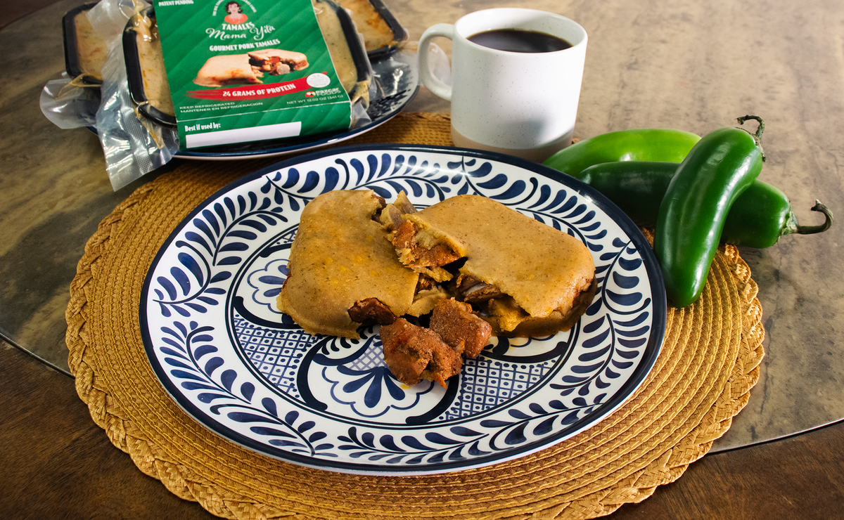 pazcar foods tamales mama yita texan mexican central american texas fusion pork tamale served in plate with jalapeños and coffee mild spice